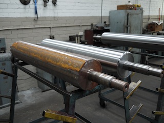 Corroded gravure rollers ground to new size, bushes replace, shaft sleeved and re-ground Corroded gravure rollers ground to new size, bushes replace, shaft sleeved and re-ground